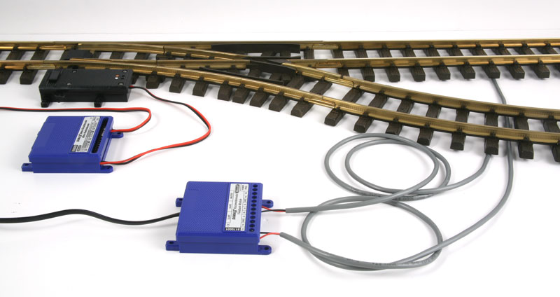 The Massoth ME_8170001 Feedback Module wired to 2 track contacts for operation of an EPL switch track motor via a central station